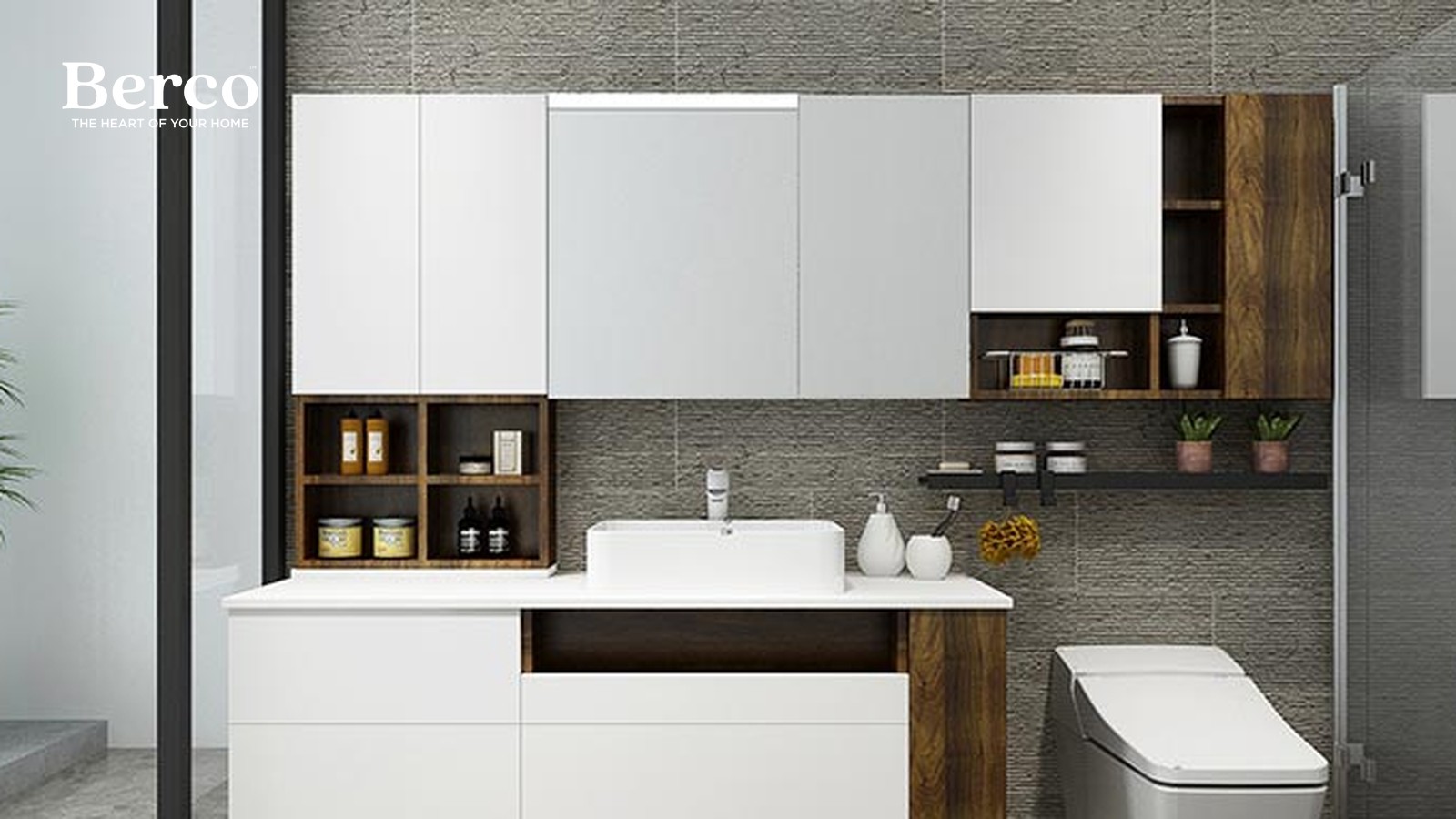 A white vanity and long white wall cabinets combined with timber open cubbies and a vessel basin against a textured stone wall — Berco design reference.