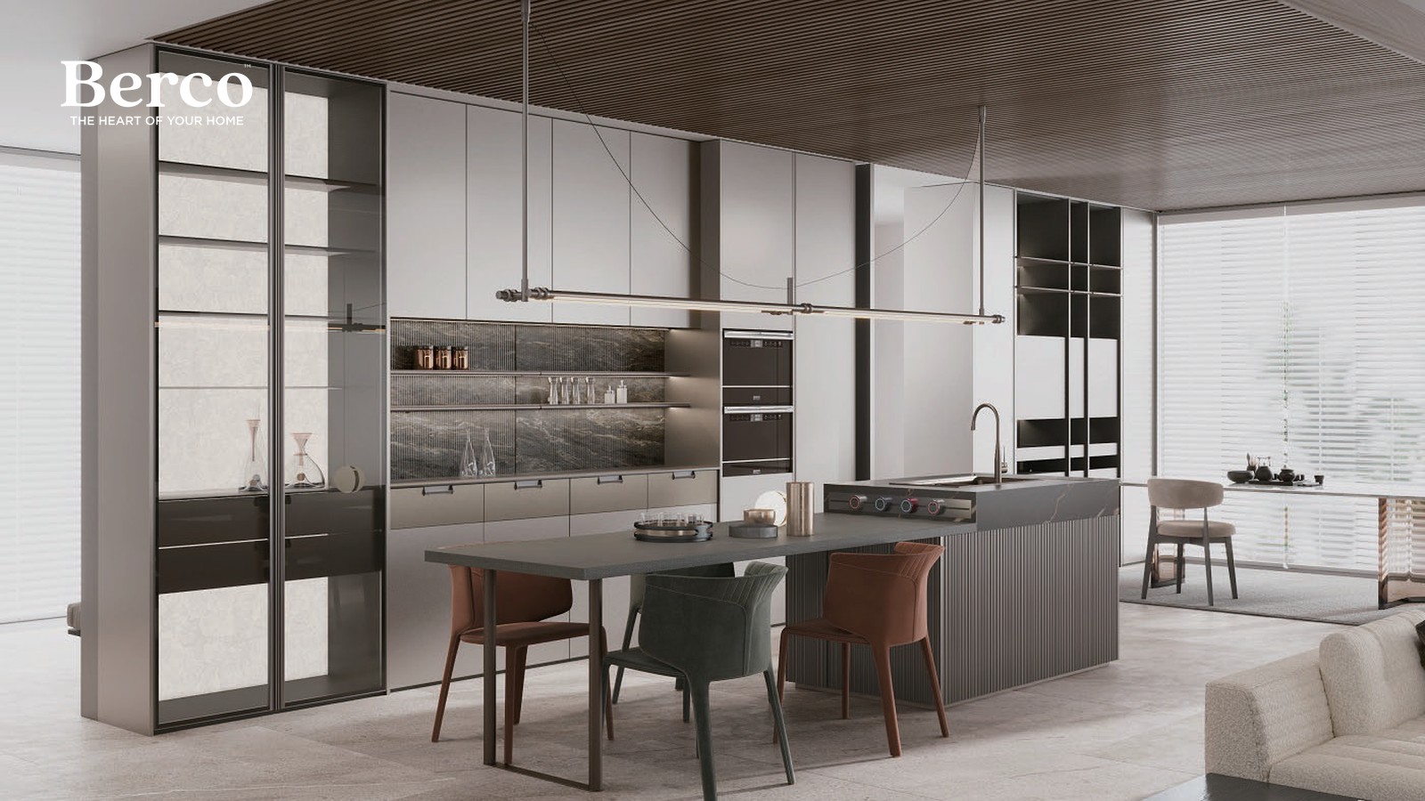 Long dining table set against a dark stone island run with tall storage and a glazed partition behind — Berco design reference