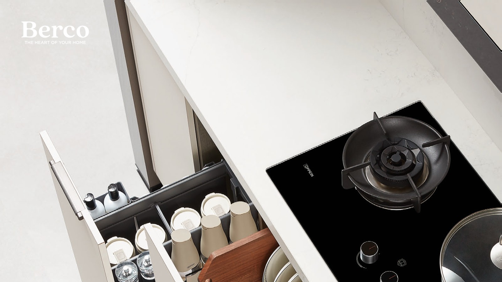Pull-out drawers with a fitted dish rack, cutlery-tray inserts and cup and jar organisers — Berco design reference