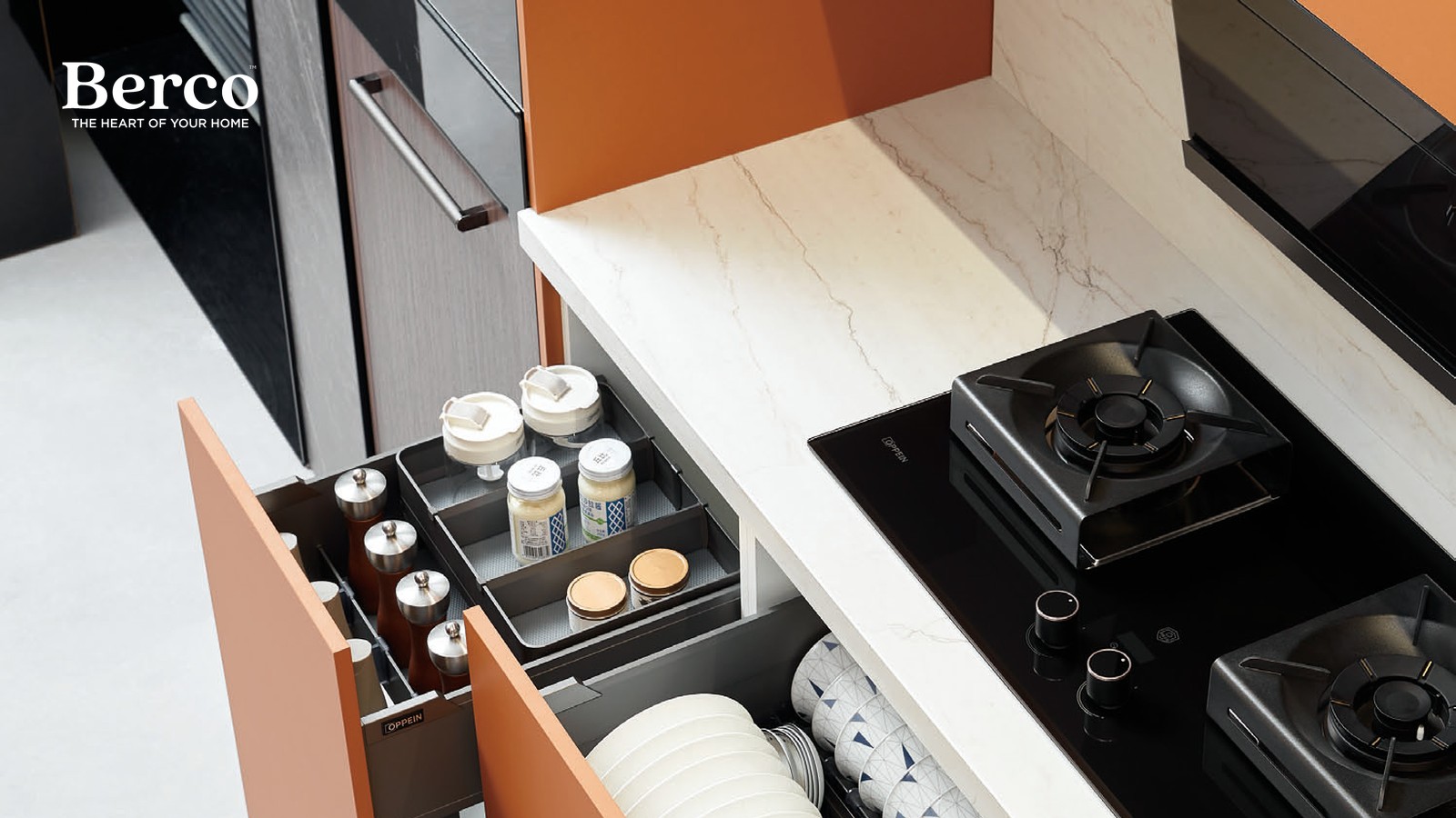 Warm terracotta pull-out drawers with a fitted dish rack and cup holders — Berco design reference