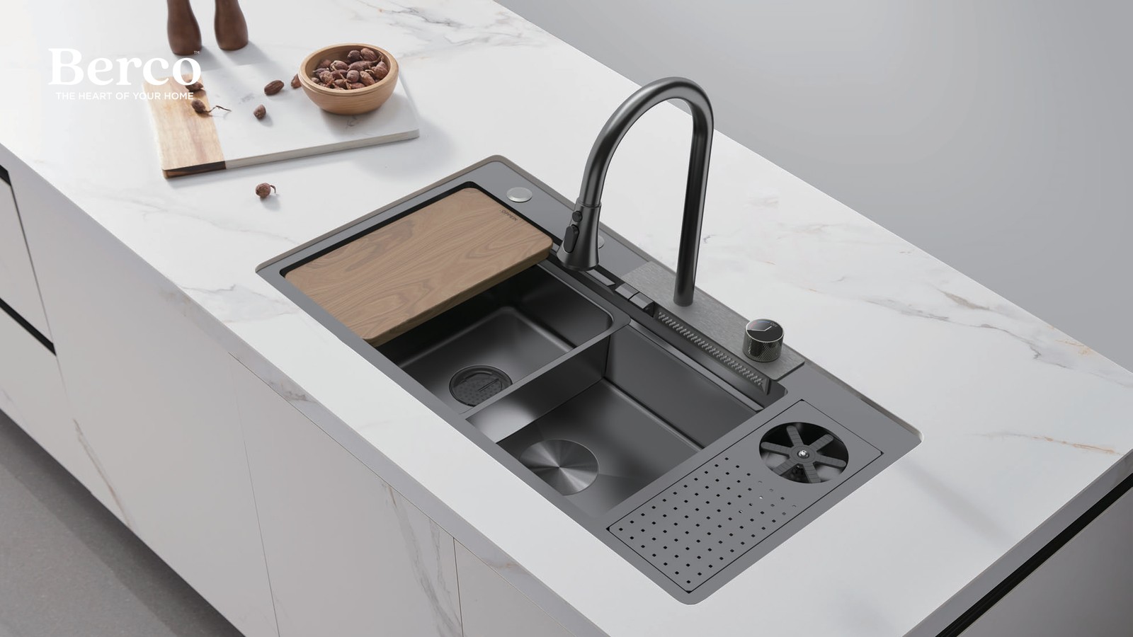 Multifunction workstation sink with a walnut board and colander set into a marble island — Berco design reference