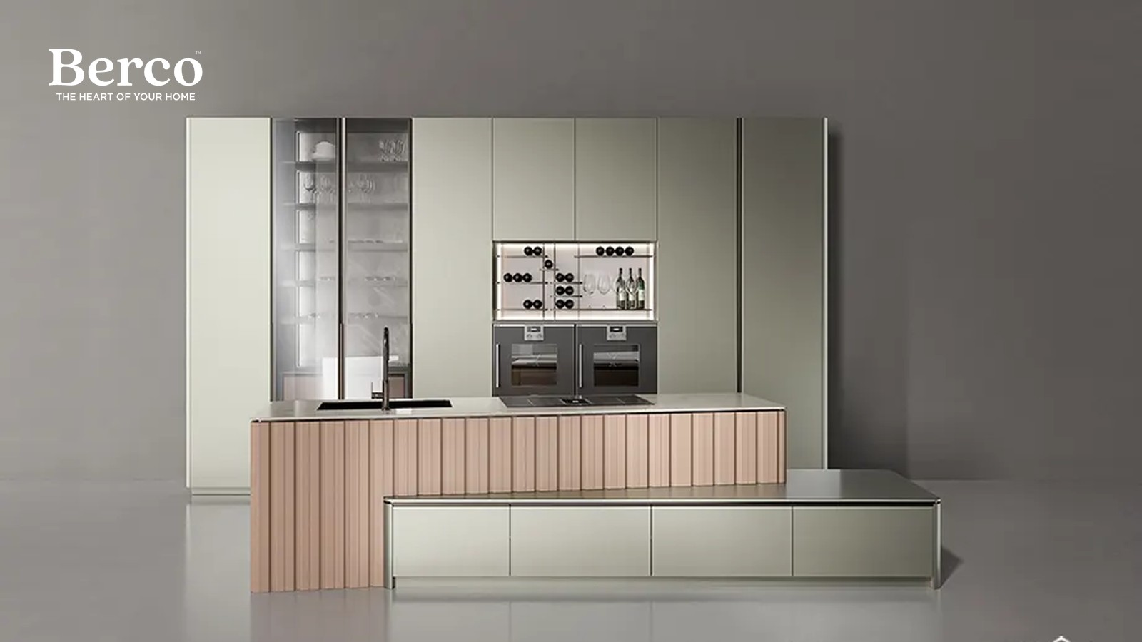 Kitchen with a fluted wood island, sage tall units and a glass-front display cabinet — Berco design reference