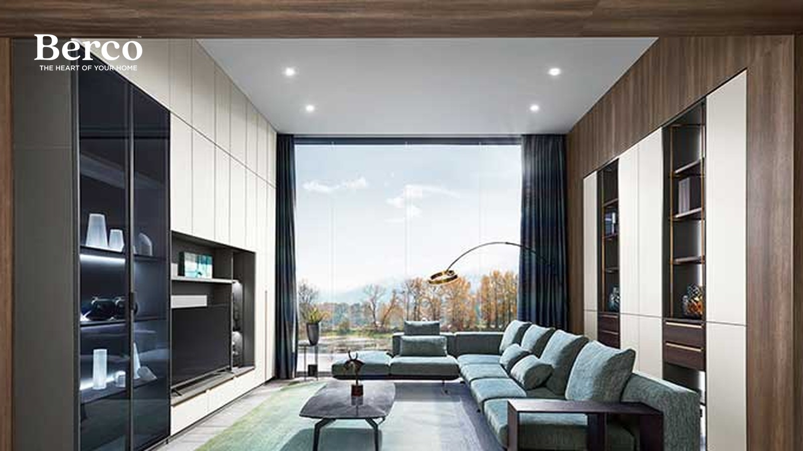 Narrow living room with full-height cabinetry on both long walls, tinted glass display doors with interior lighting and a dark recessed screen niche — Berco design reference.